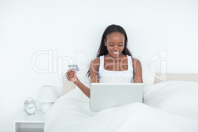 Young woman booking her holidays online