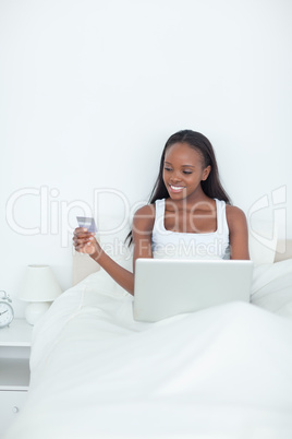 Portrait of a young woman booking her holidays online