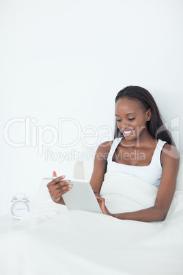 Portrait of a young woman using a tablet computer