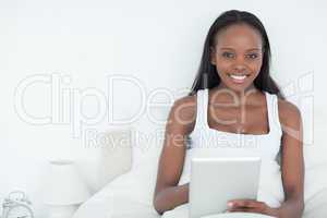 Serene woman using a tablet computer