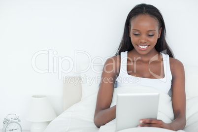 Calm woman using a tablet computer