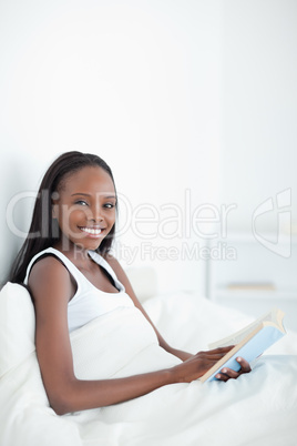 Portrait of a woman holding a book