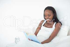 Happy woman reading a book
