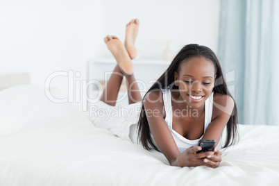 Young woman sending text messages