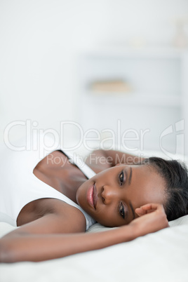 Portrait of a calm woman lying on her back