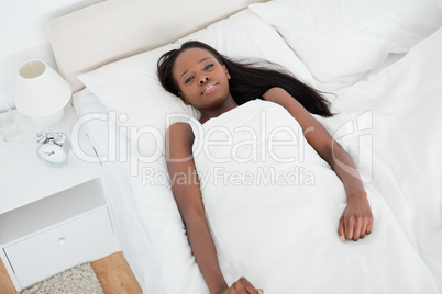 Woman lying on her bed
