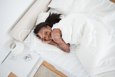 Above view of a woman waking up