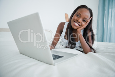 Woman watching a movie on her laptop
