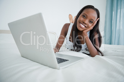 Woman watching a movie on her notebook