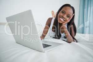 Woman watching a movie on her notebook