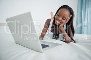 Young woman watching a movie on her notebook