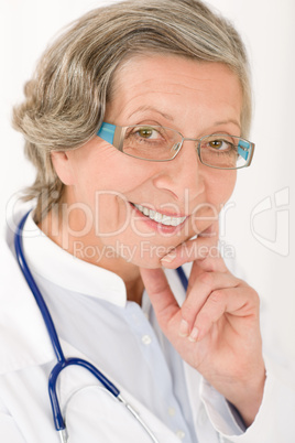 Senior doctor female with stethoscope smiling