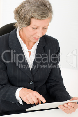 Senior businesswoman touch-screen tablet computer