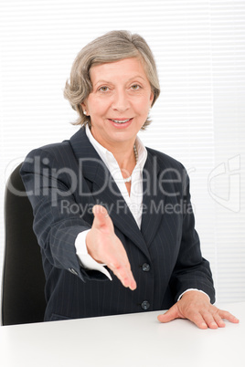 Senior businesswoman handshake close deal smiling