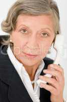 Senior businesswoman on phone close-up portrait