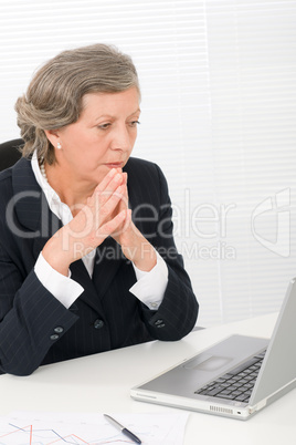 Senior businesswoman look seriously at computer