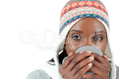 Student woman enjoying a cup of tea in the cold