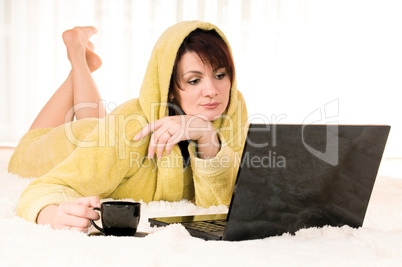 woman with laptop and cup