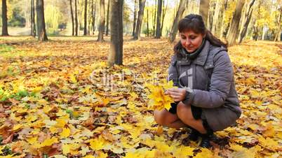 Woman Collects Leaves