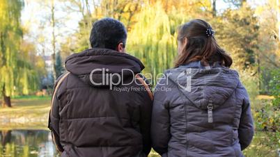 Couple Sits In Park