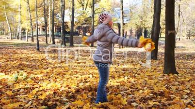 Girl Rotates With Leaves, Slow Motion