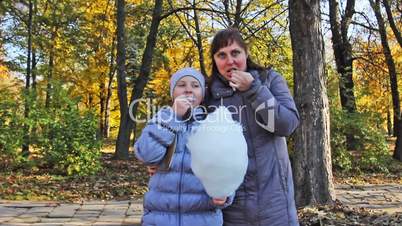 Mom With Daughter Eat Cotton Candy