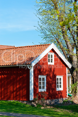 traditional red cottage in sweden