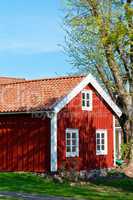 traditional red cottage in sweden