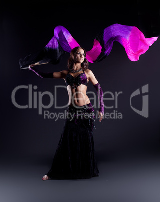 girl in oriental arabic costume dance with fantail