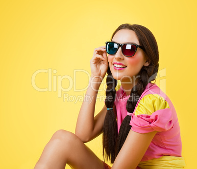 Funny woman in doll dress look in stereo glasses
