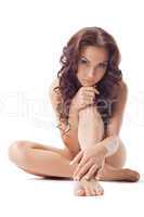 Young nude brunette look at camera