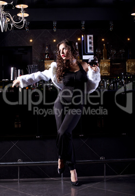 Beauty woman stand near bar in luxury cloth
