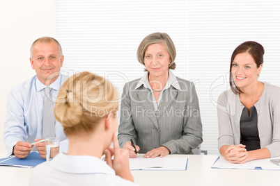 Job interview young woman with business team