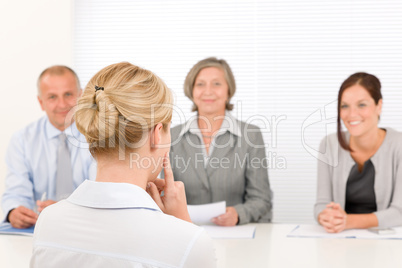 Job interview young woman with business team