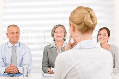 Job interview young woman with business team