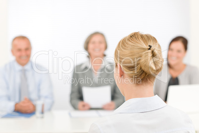 Job interview young woman with business team