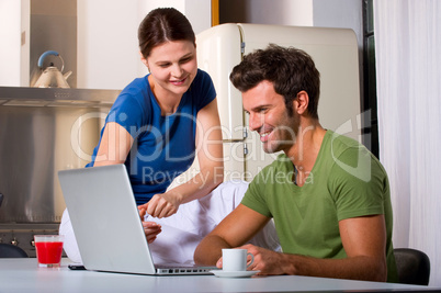 couple having breakfast in the kitchen