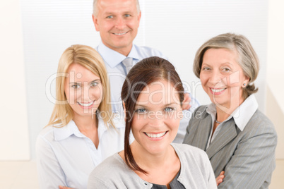 Business team young woman with mature colleagues