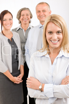 Business team young woman with mature colleagues