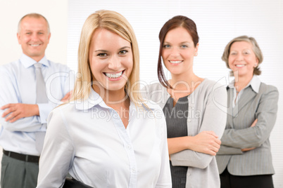 Business team young woman with mature colleagues