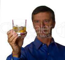 Senior man with glass of whisky