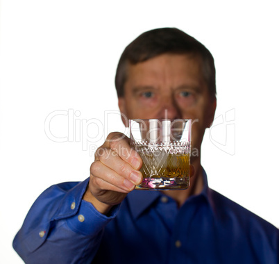 Senior man with glass of whisky