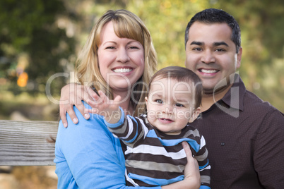 Happy Mixed Race Ethnic Family Posing for A Portrait