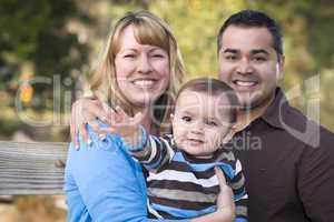 Happy Mixed Race Ethnic Family Posing for A Portrait