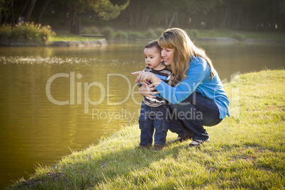 Happy Mother and Baby Son Looking Out At Lake