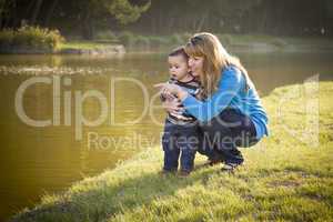 Happy Mother and Baby Son Looking Out At Lake