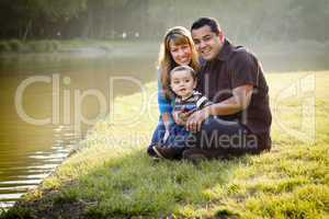 Happy Mixed Race Ethnic Family Posing for A Portrait