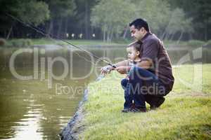 Happy Young Ethnic Father and Son Fishing