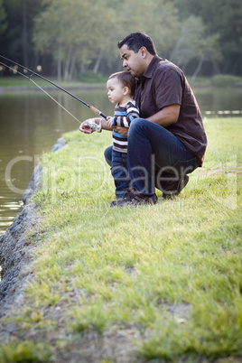 Happy Young Ethnic Father and Son Fishing