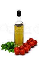 bottle of olive oil with cherry and arugula